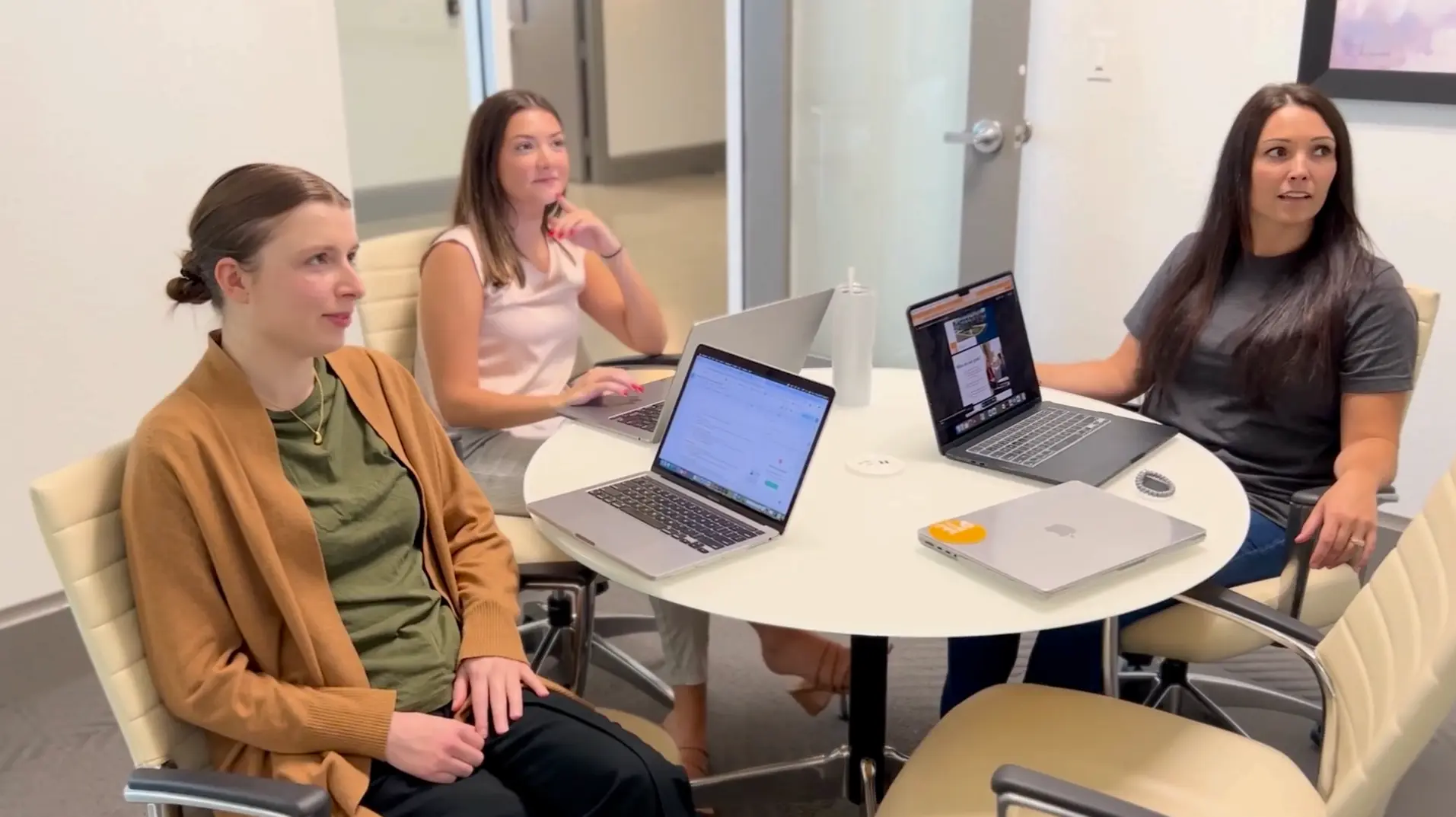 Woman sitting around table planning marketing strategies